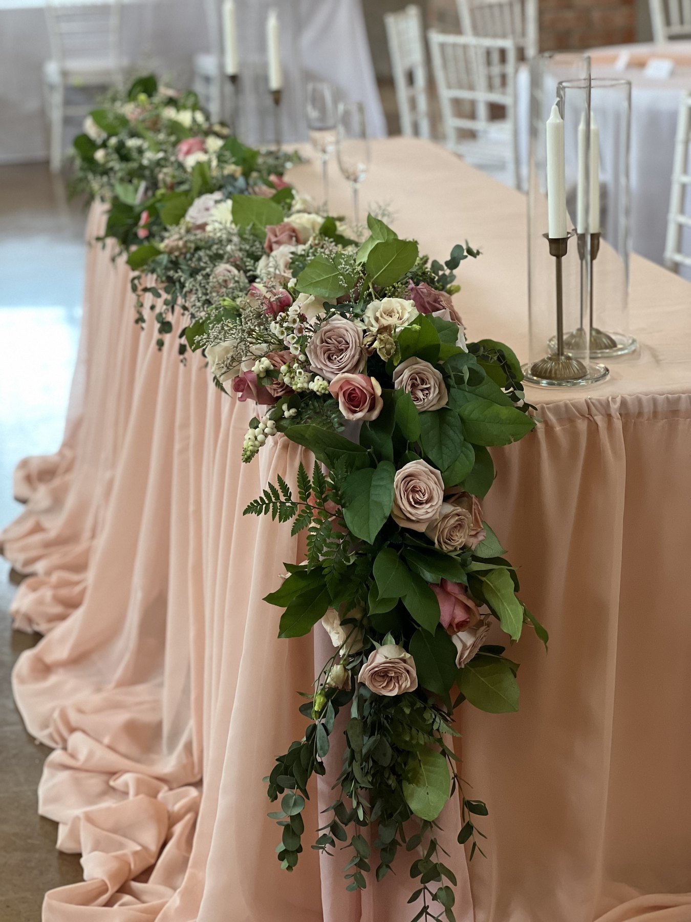 Blush drapery and floral ceremony display