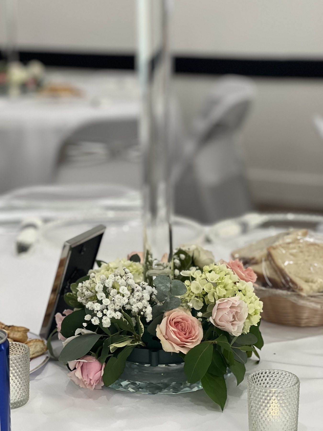 Elegant white table setup with floral arrangements